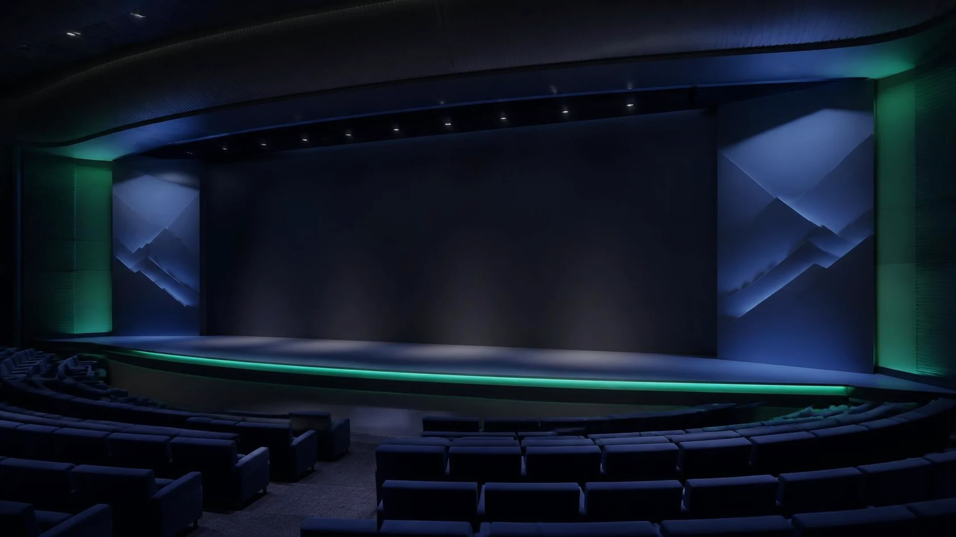 Empty contemporary auditorium with a dark keynote stage and Alpine-inspired panels.
